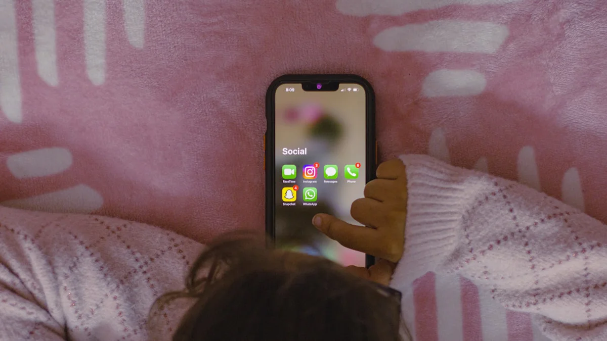 Phone showing screen time statistics with a dramatic decrease graph